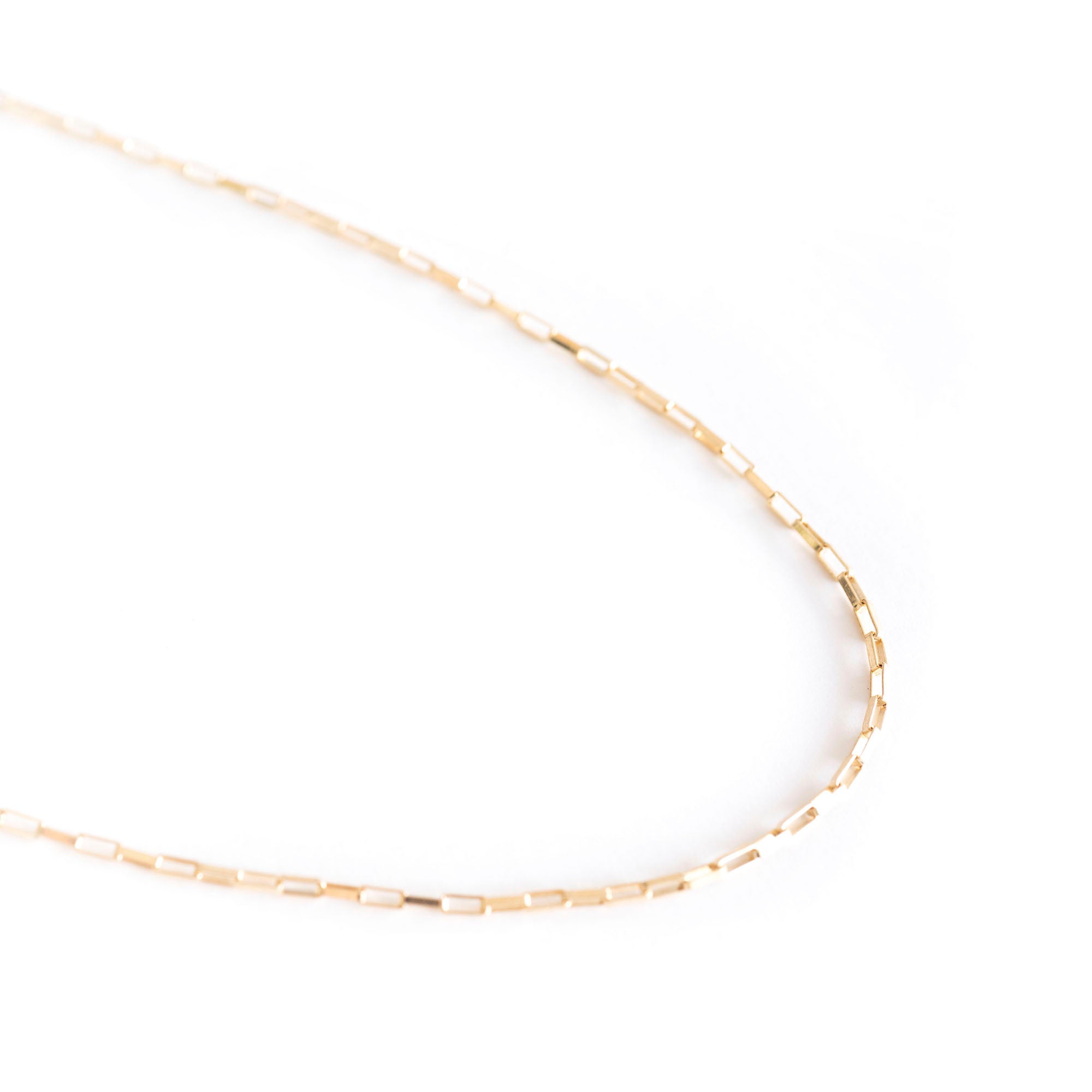 The Gold Filled Box Necklace features a delicate 14k gold filled chain with rectangular links for a timeless look, shown on a white background.