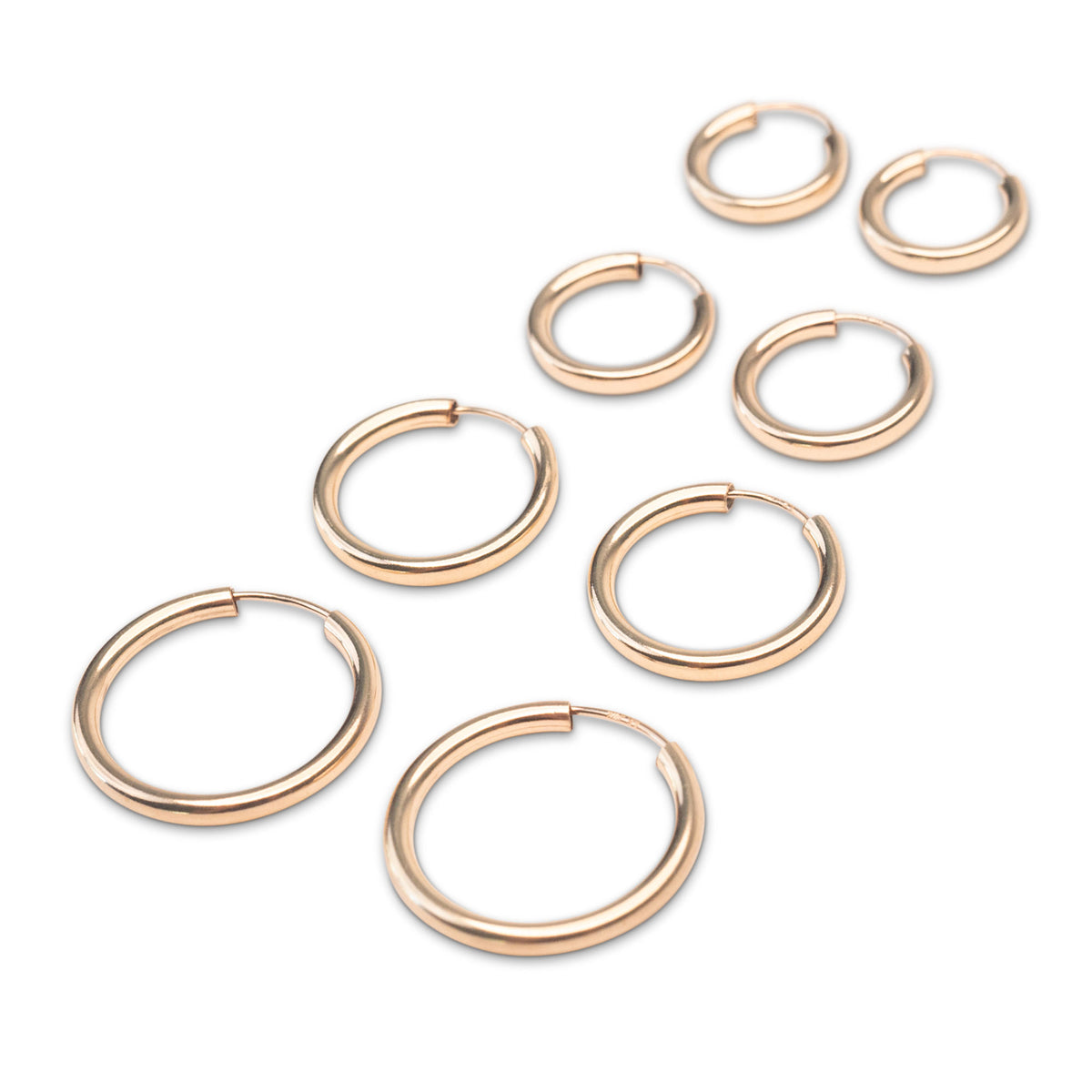 Polished gold endless hoops showing smooth continuous design