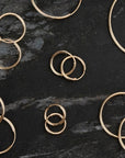 Gold endless hoop earrings with a seamless circular design