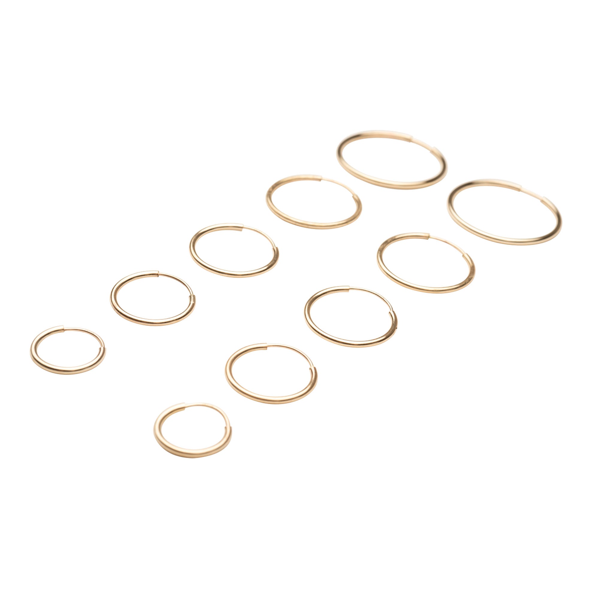 Gold hoop earrings on a white background
